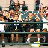 Young fans of the Long Island Ducks cheer on their home team on July 24, 2012 at Bethpage Ballpark. Photo by Matthew Maron