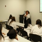 Kathleen Burke and Franny Bavaro teach high school students about standardized patients on July 25, 2012. Photo by Matthew Maron
