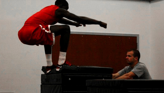 the Stony Brook mens Basketball warms up their muscles for their workout. Photo by Liza Bell